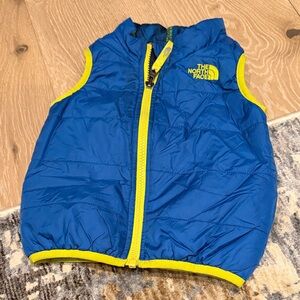 The North Face Blue Vest with Yellow Trim